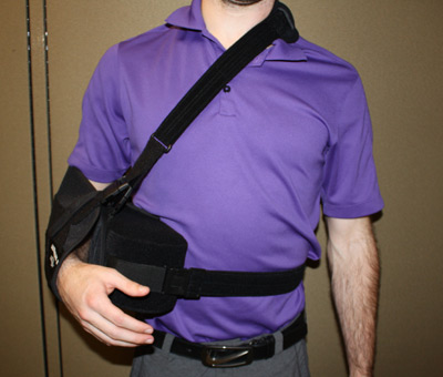 Front view of person with a shoulder immobilizer